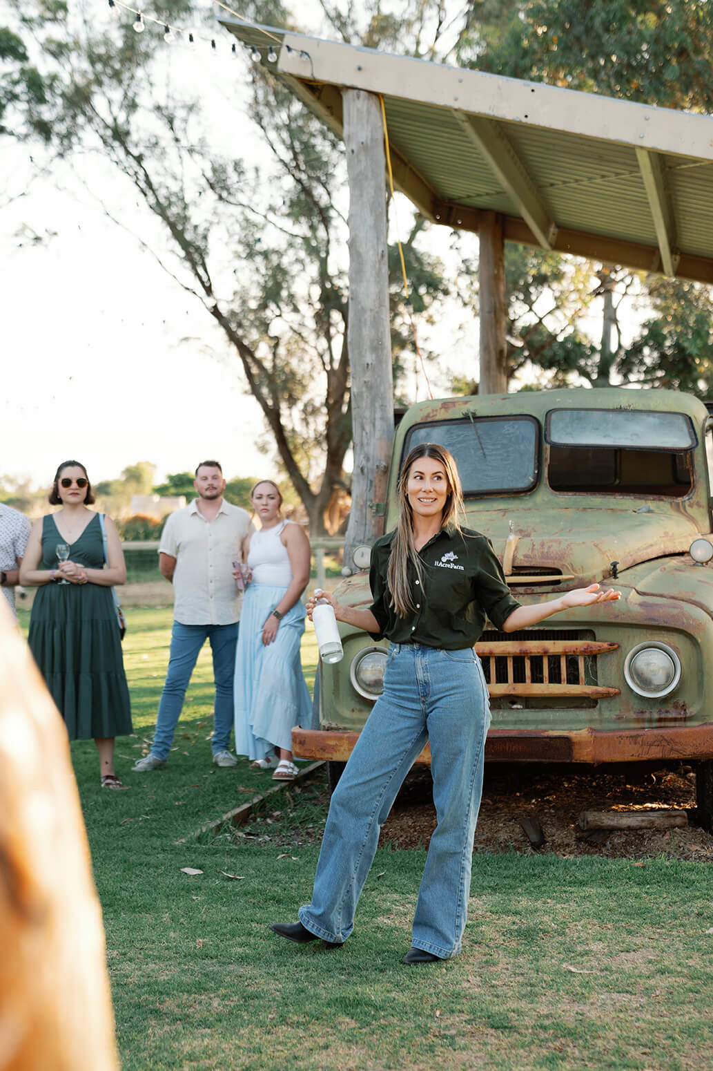 Erin Erceg talking about 11 Acre Farm to a group of people