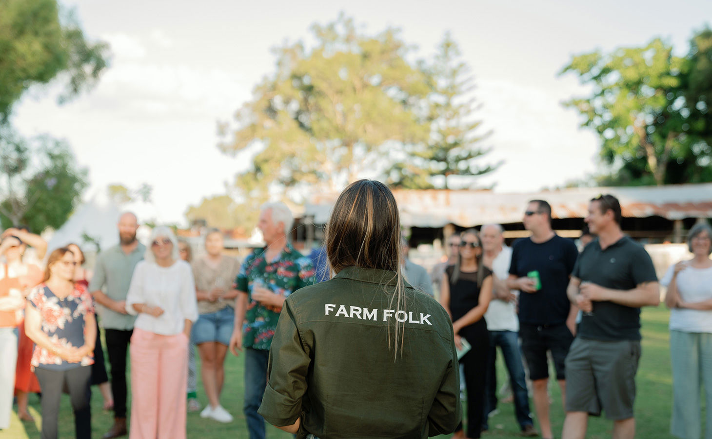 11 Acre Farm staff member talking to a group of people